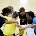Dexter Shooting Academy youth basketball players huddle together and scream before the start of a game on Tuesday, July 9. Daniel Brenner I AnnArbor.com